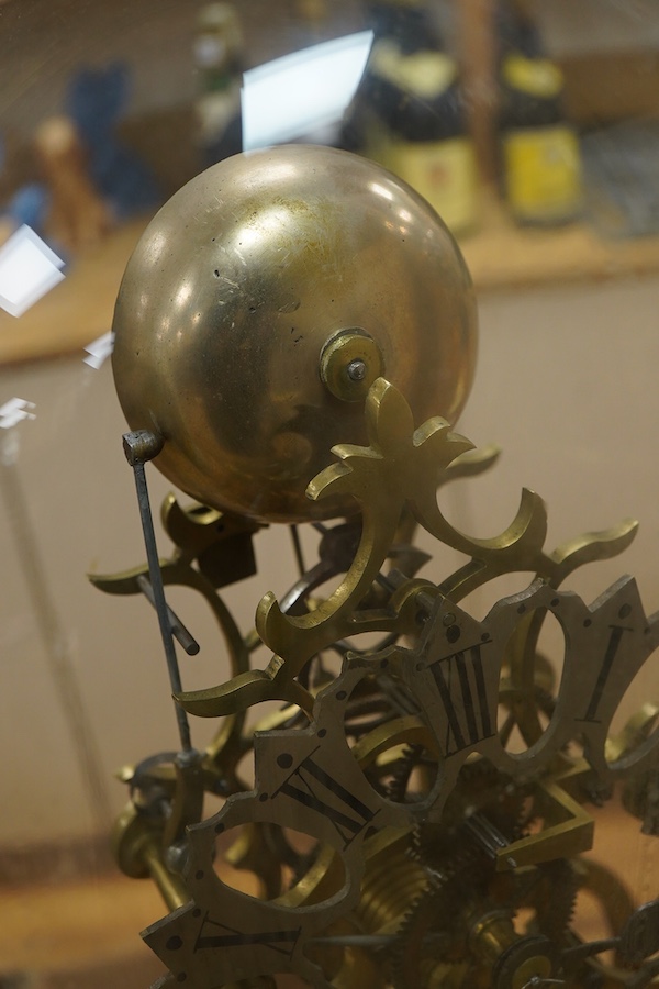 A Victorian brass framed skeleton clock, under a glass dome, 44cm